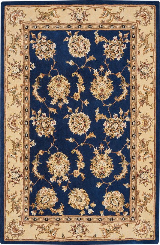 Rectangular Persian-style rug with navy field, cream border and gold floral medallions along scrolling vines.