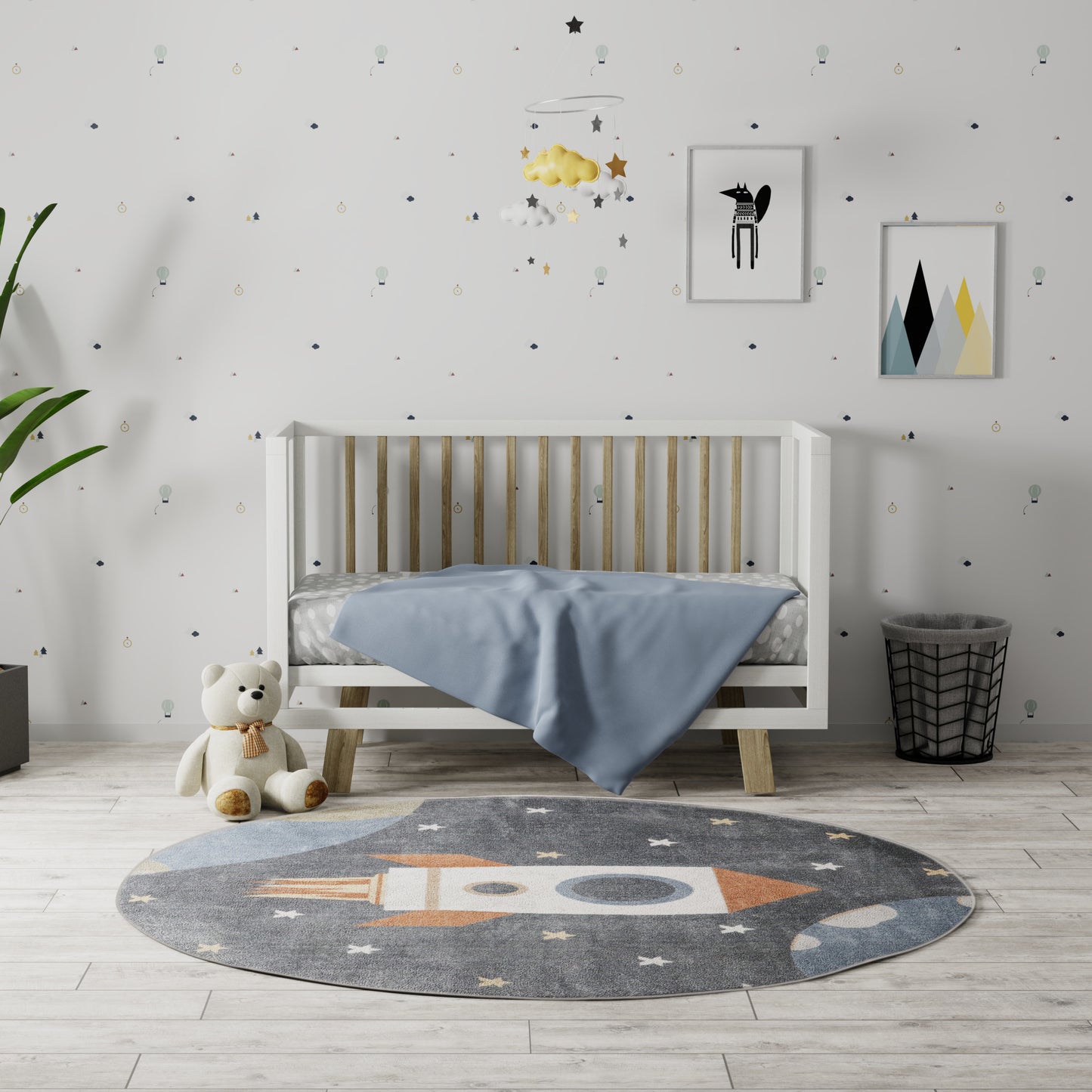 Round gray rug with rocket design, 4' diameter.
