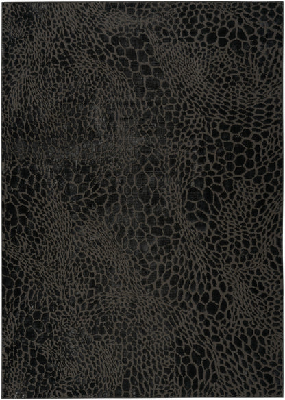 Dark black modern rug with a snakeskin-embossed pattern; 5' x 7'.