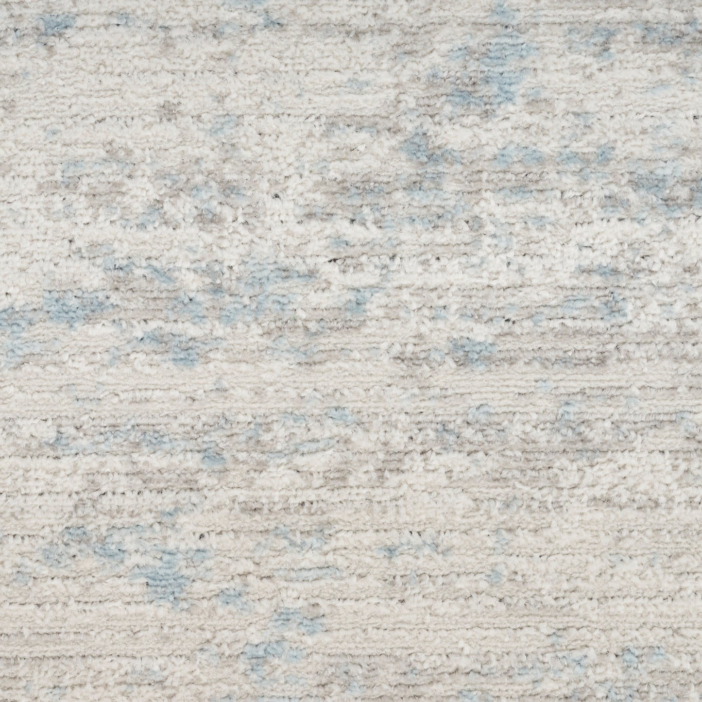 Cream-beige runner rug with soft plush pile and subtle light blue patches.