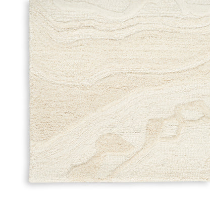Cream beige textured rug with a subtle wavy embossed pattern in a soft neutral color.