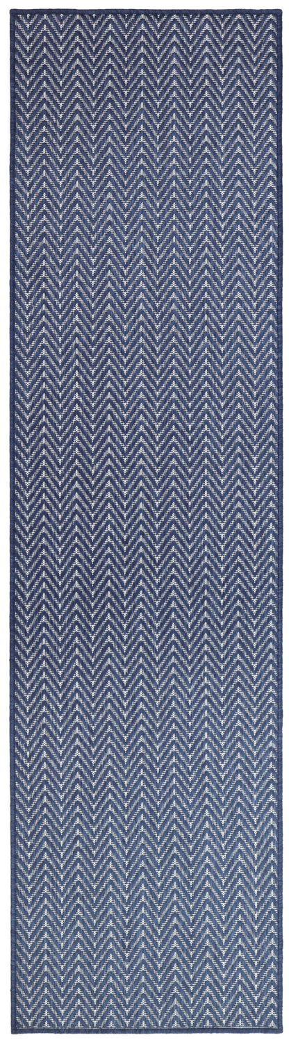 Navy blue chevron-patterned rug runner with light gray zigzags; woven texture for hallway decor.