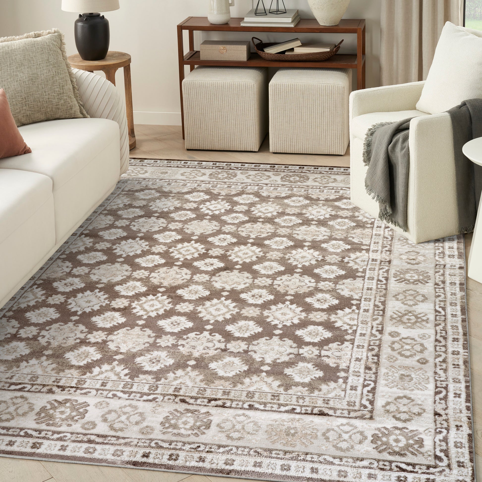 Rectangular beige taupe woven rug with ivory floral medallion pattern and decorative border for living room.