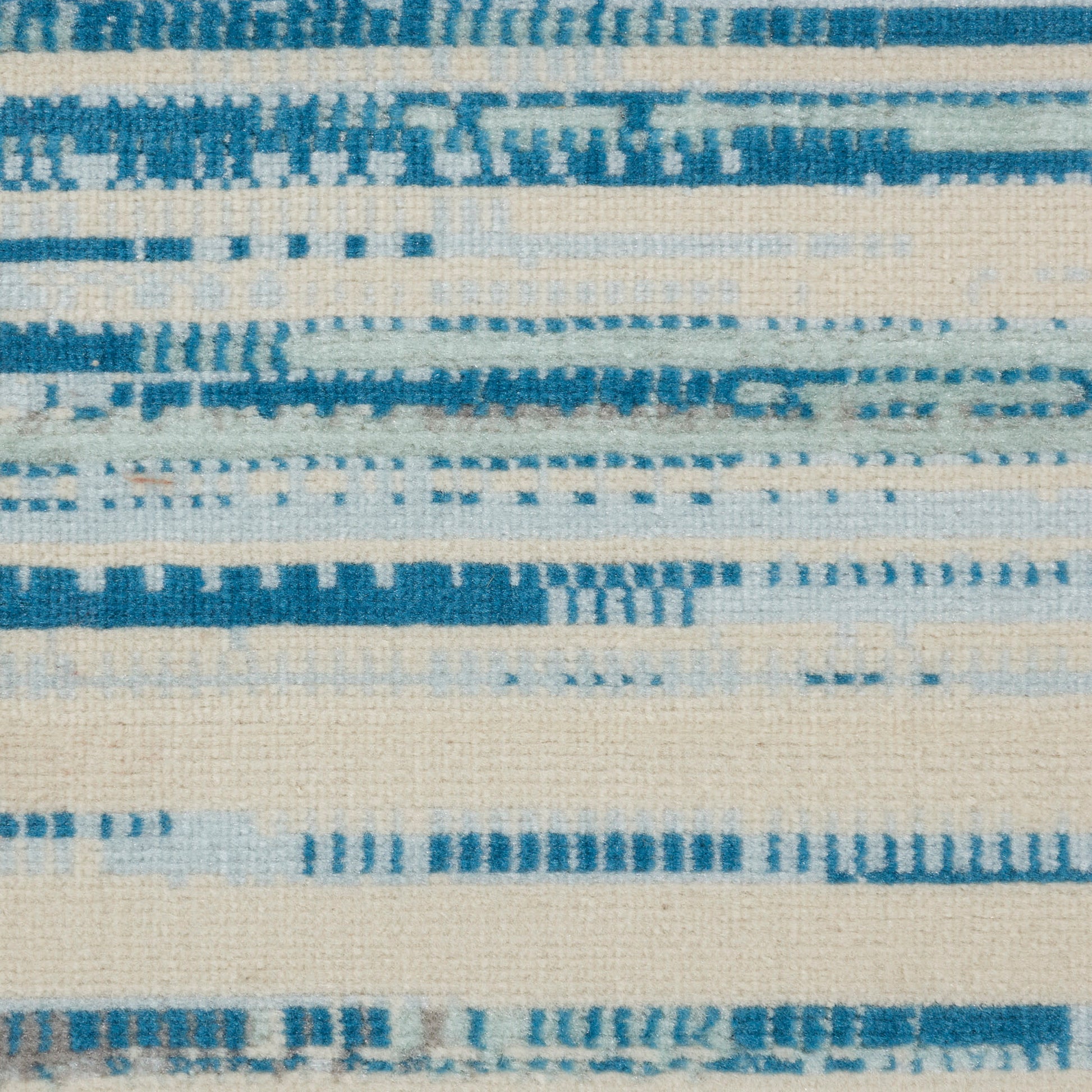 Beige rug with blue horizontal stripes; linen-like texture, casual home decor.