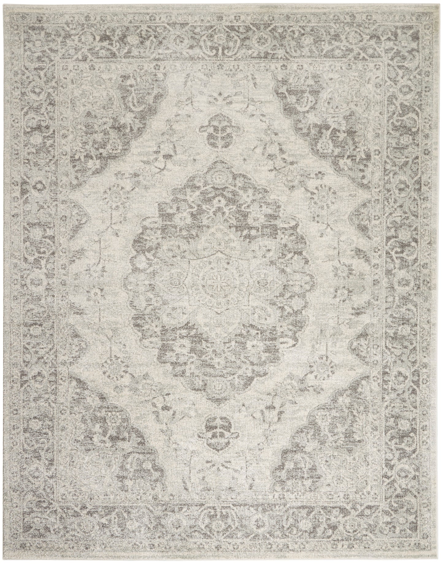 Light gray-beige Persian-style rug with central medallion and ornate border; distressed vintage look.