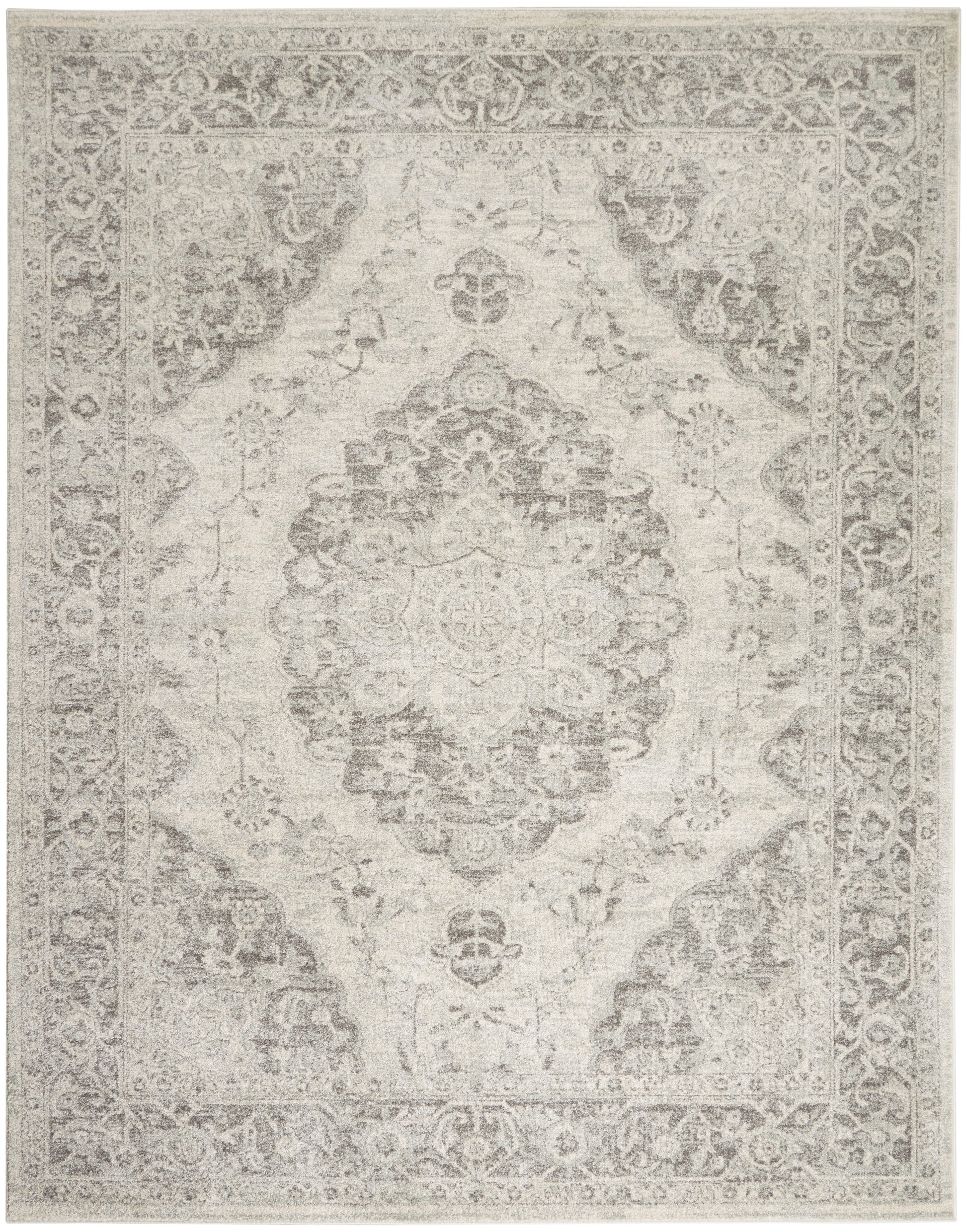 Light gray-beige Persian-style rug with central medallion and ornate border; distressed vintage look.