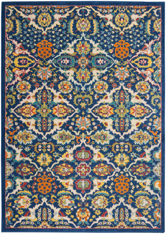 Rectangular Persian-style rug with blue border and vibrant multicolor floral damask patterns.