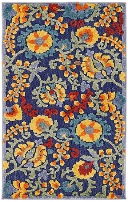 Rectangular outdoor woven rug with navy background and bright yellow, orange, green and purple floral damask pattern.