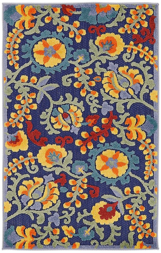 Rectangular outdoor woven rug with navy background and bright yellow, orange, green and purple floral damask pattern.