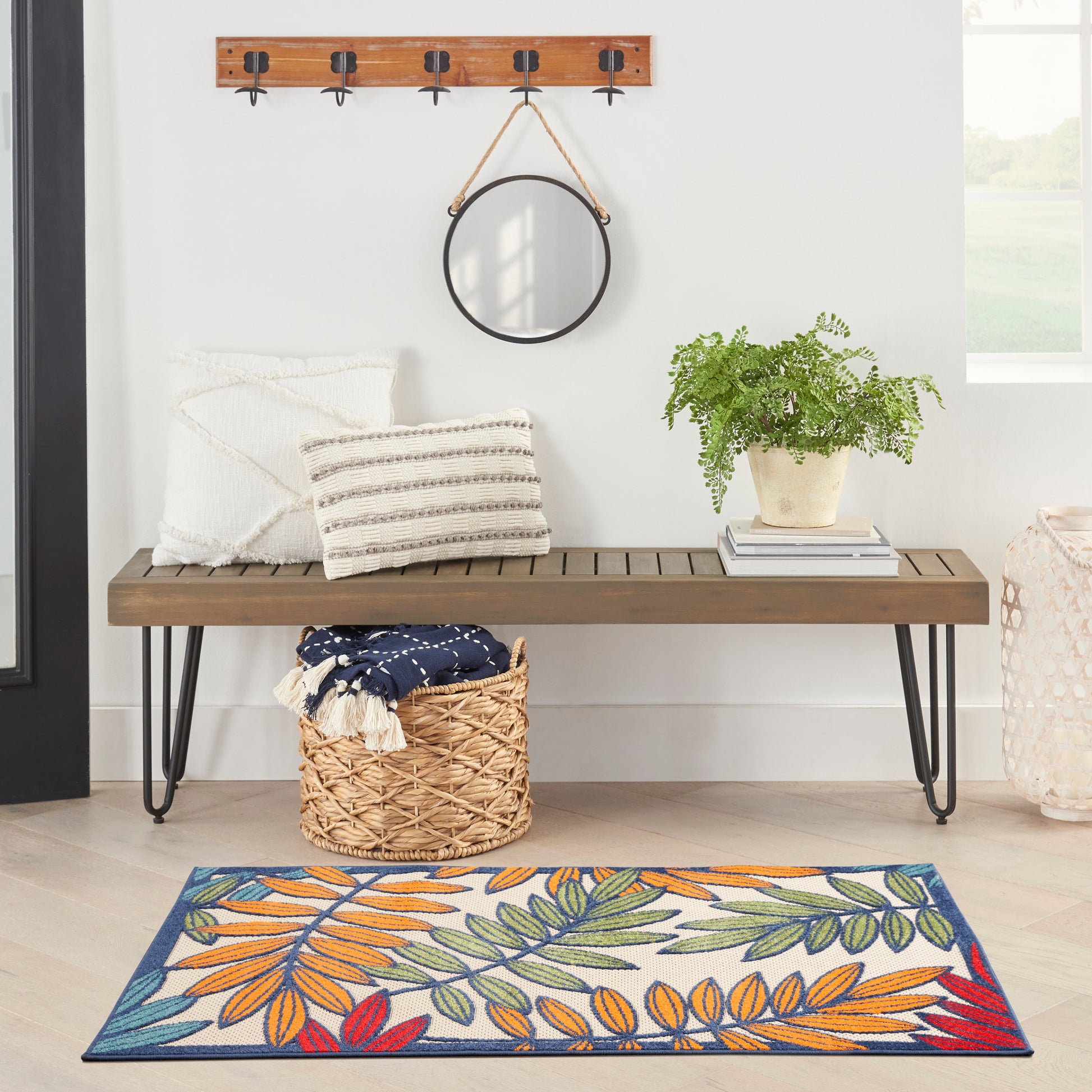 Tropical-patterned rug on floor, 3' x 5'.