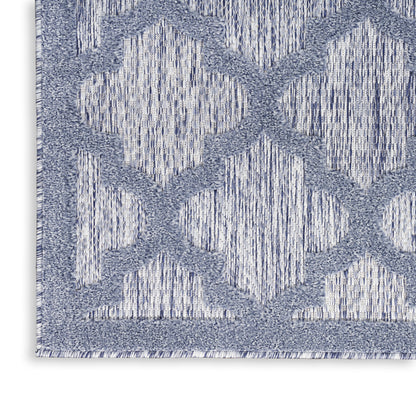 Blue and white geometric area rug with diamond trellis pattern and woven texture.