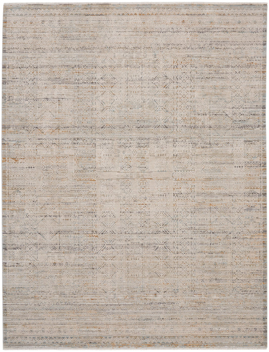Neutral geometric patchwork rug in beige, taupe, and gray with a distressed weave and subtle diamond motifs.