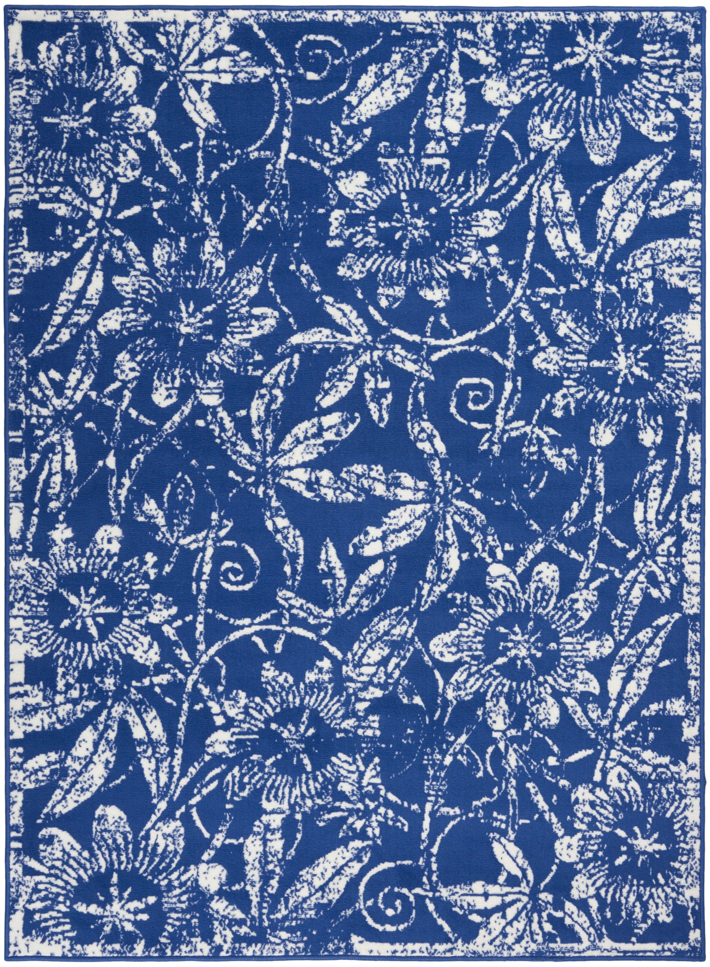 Blue rug with white floral damask pattern featuring vines and large blooms, bordered edge.
