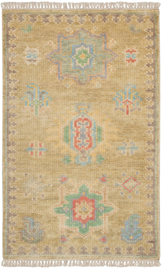 Fringe-trimmed mustard kilim rug with pastel star medallions and lilac border; cozy floor decor.