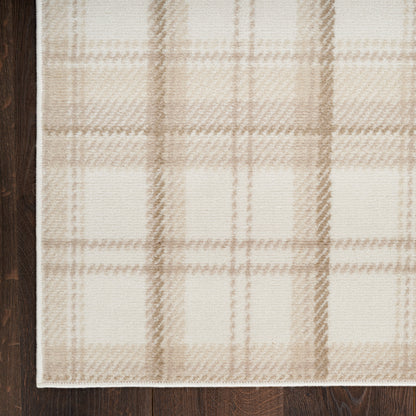 Beige plaid woven rug with tan-brown lines, soft texture, rectangular shape for living room on dark wood floor.
