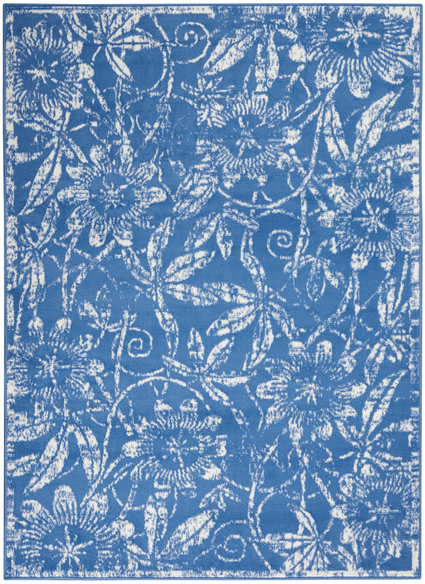 Blue textile with white floral damask pattern of daisies and curling vines.