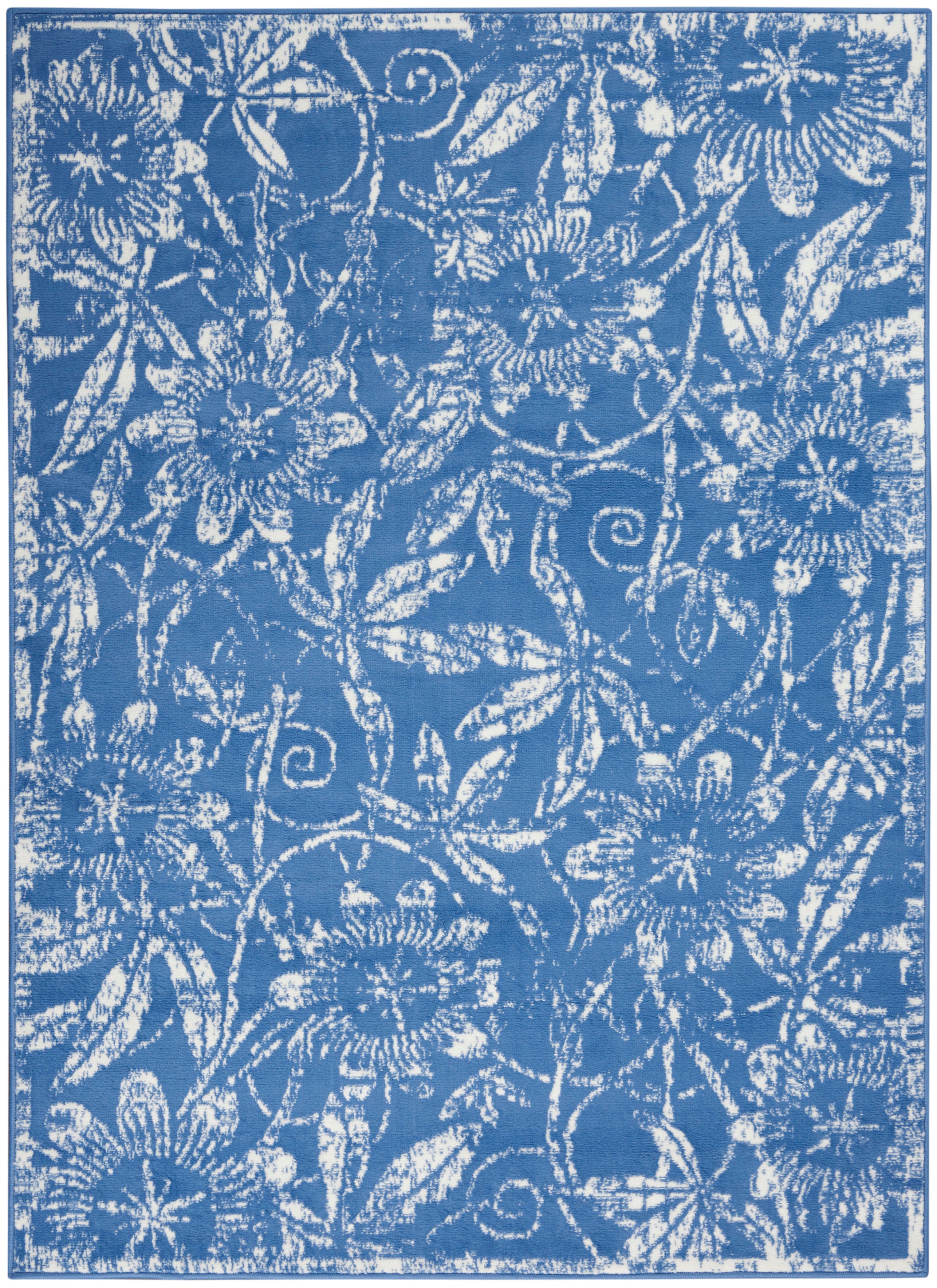 Blue textile with white floral damask pattern of daisies and curling vines.
