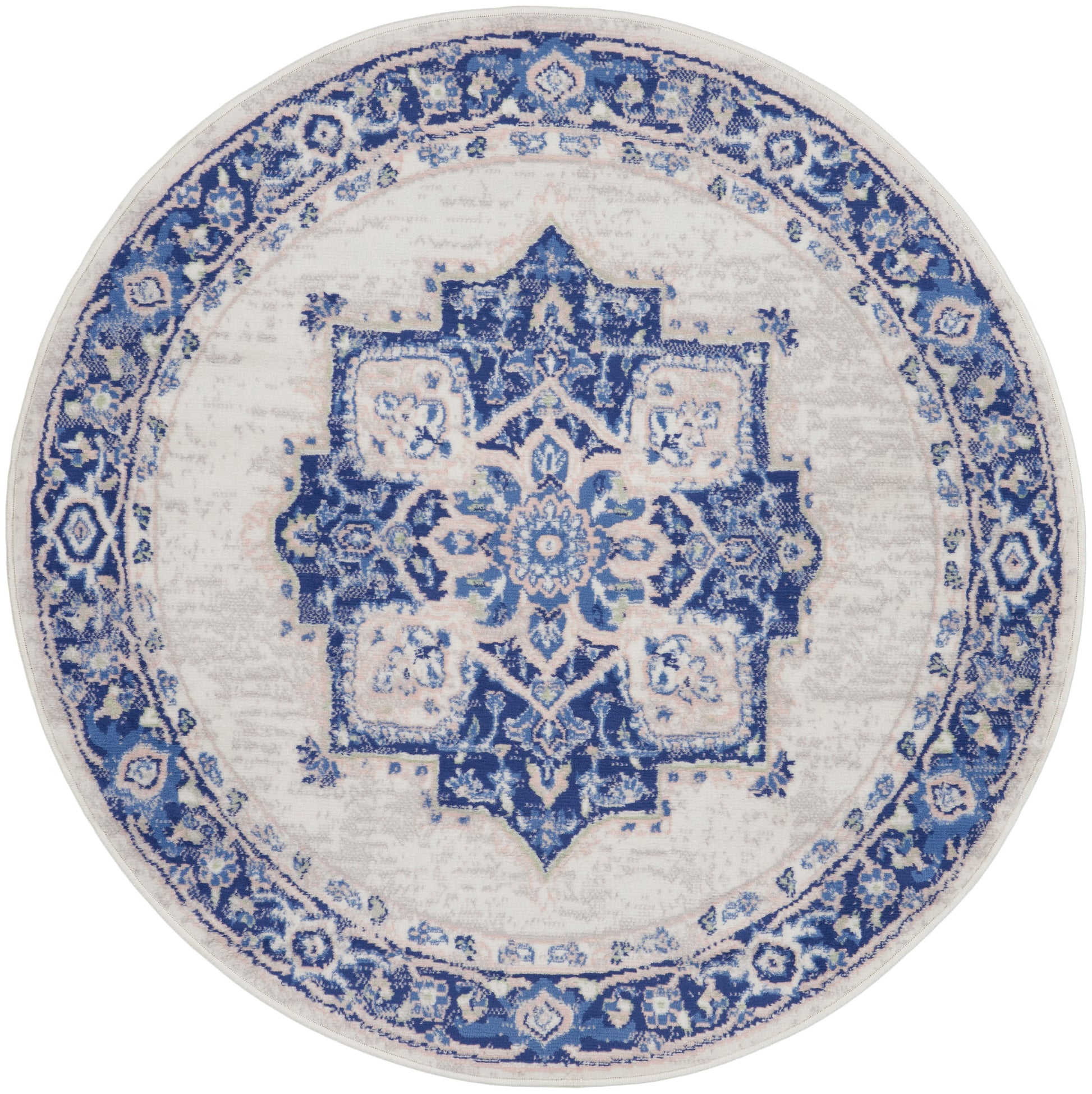 Round blue and white oriental rug with intricate central medallion and ornate floral border.