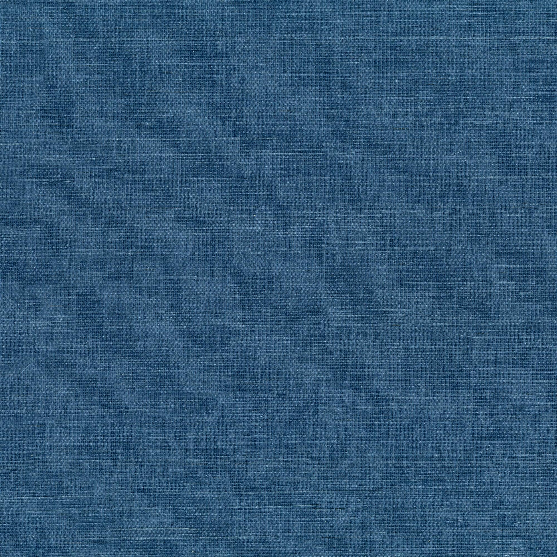 Blue wallpaper with a subtle crosshatched grasscloth-style texture.