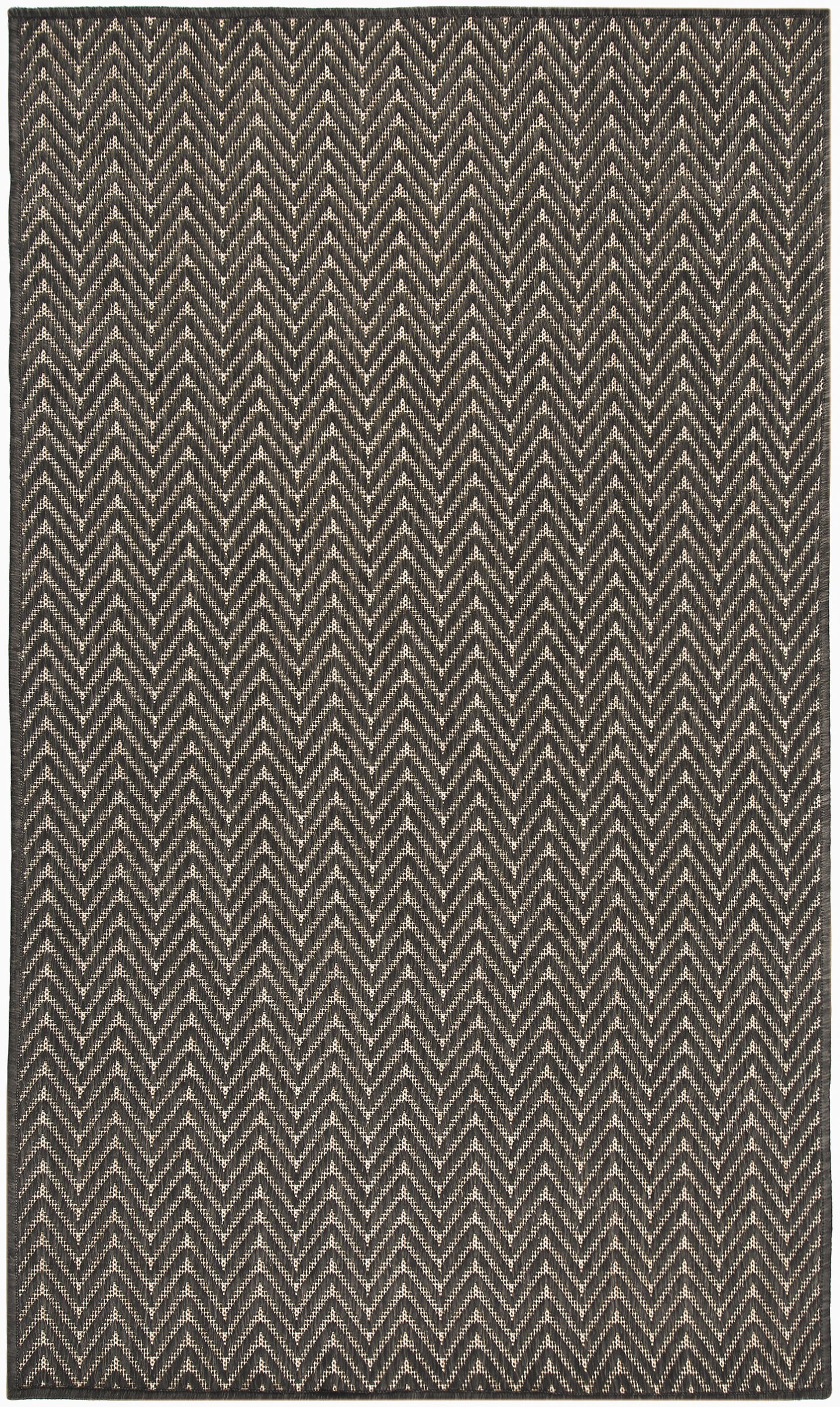 Rectangular woven rug in black & cream with a bold chevron zigzag pattern, textured geometric style.