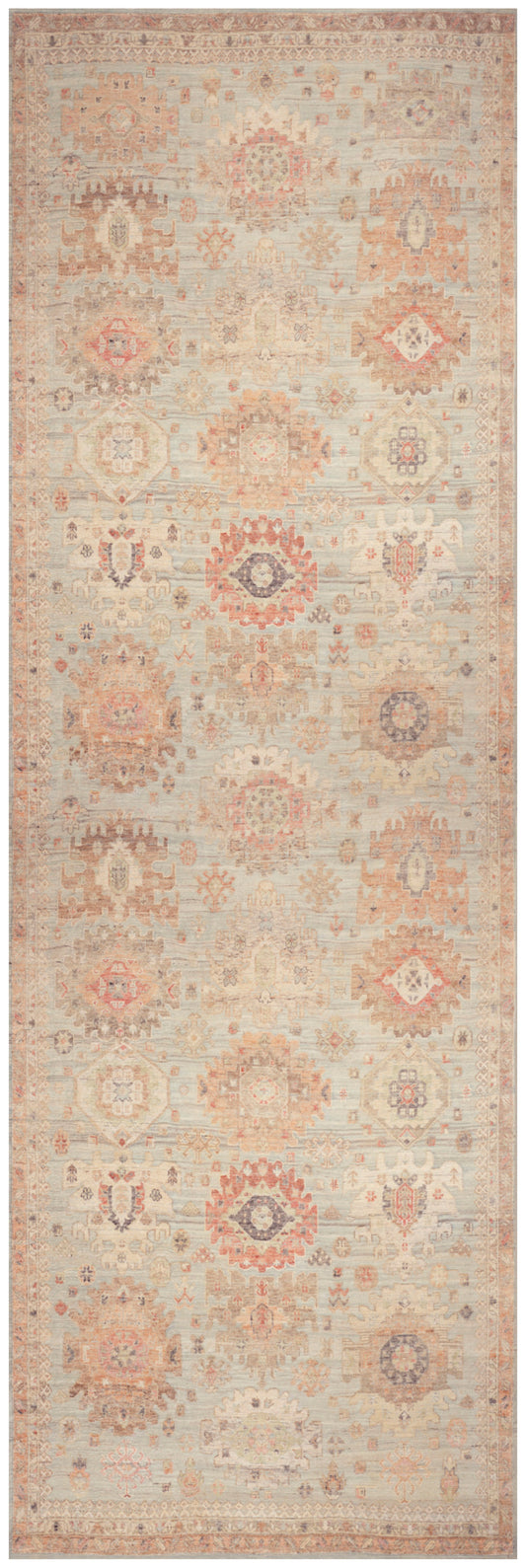 Beige vintage kilim-inspired runner rug with faded peach geometric medallions and pale blue accents.