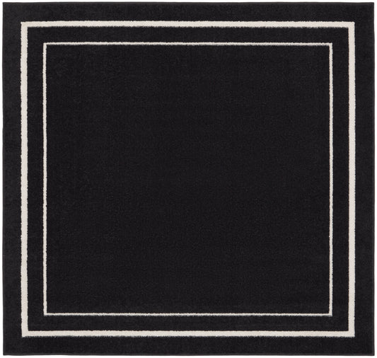 Black square rug with white nested square borders along the edge, modern minimalist geometric design.