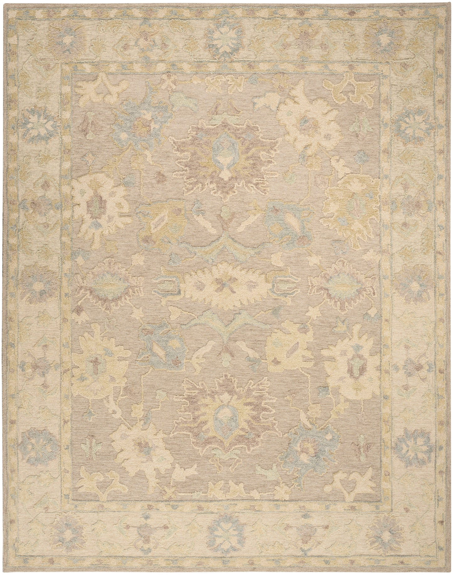 Rectangular, antique-inspired pastel oriental rug with beige field, central medallion, & muted blue, cream, pink floral border.