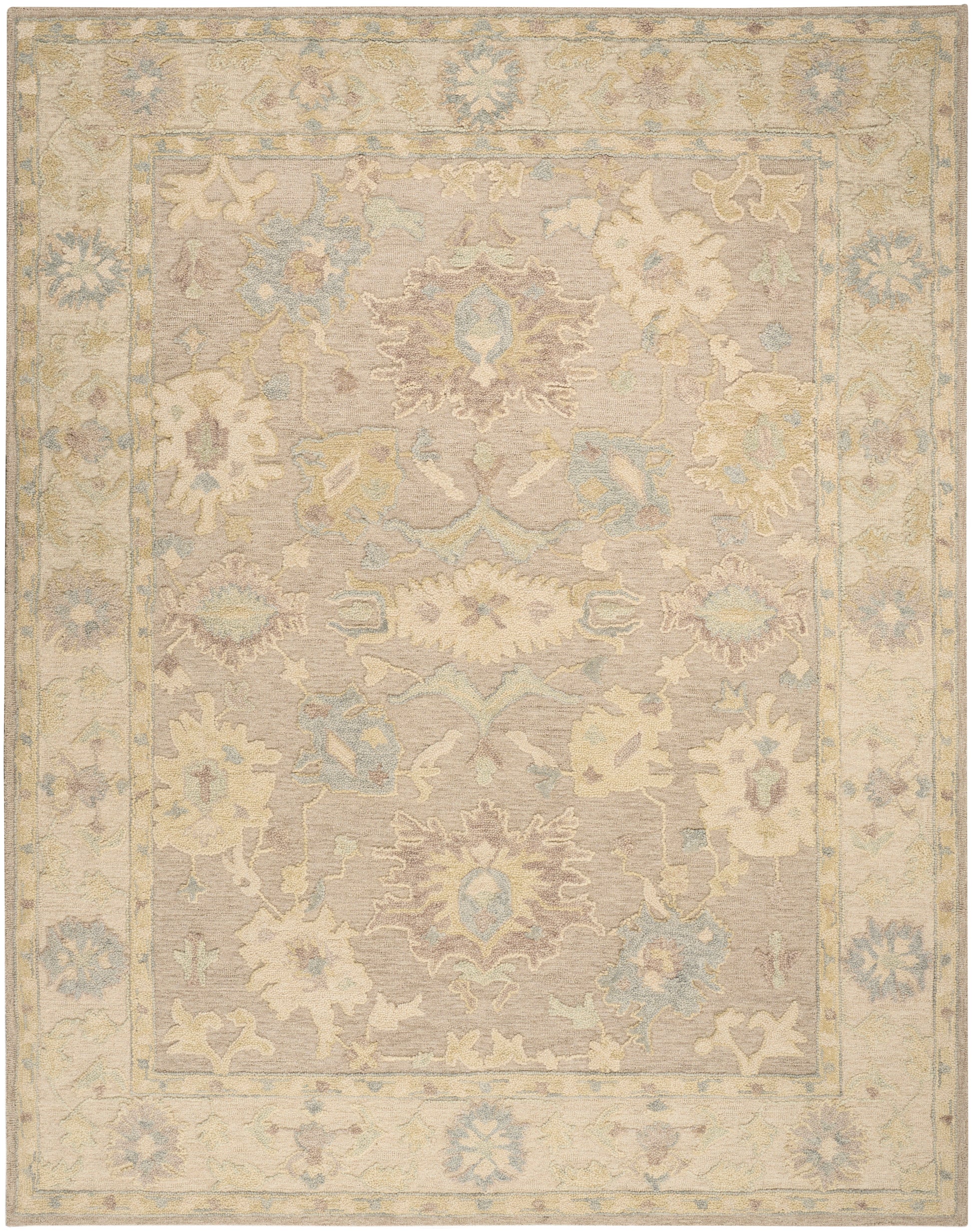 Rectangular, antique-inspired pastel oriental rug with beige field, central medallion, & muted blue, cream, pink floral border.