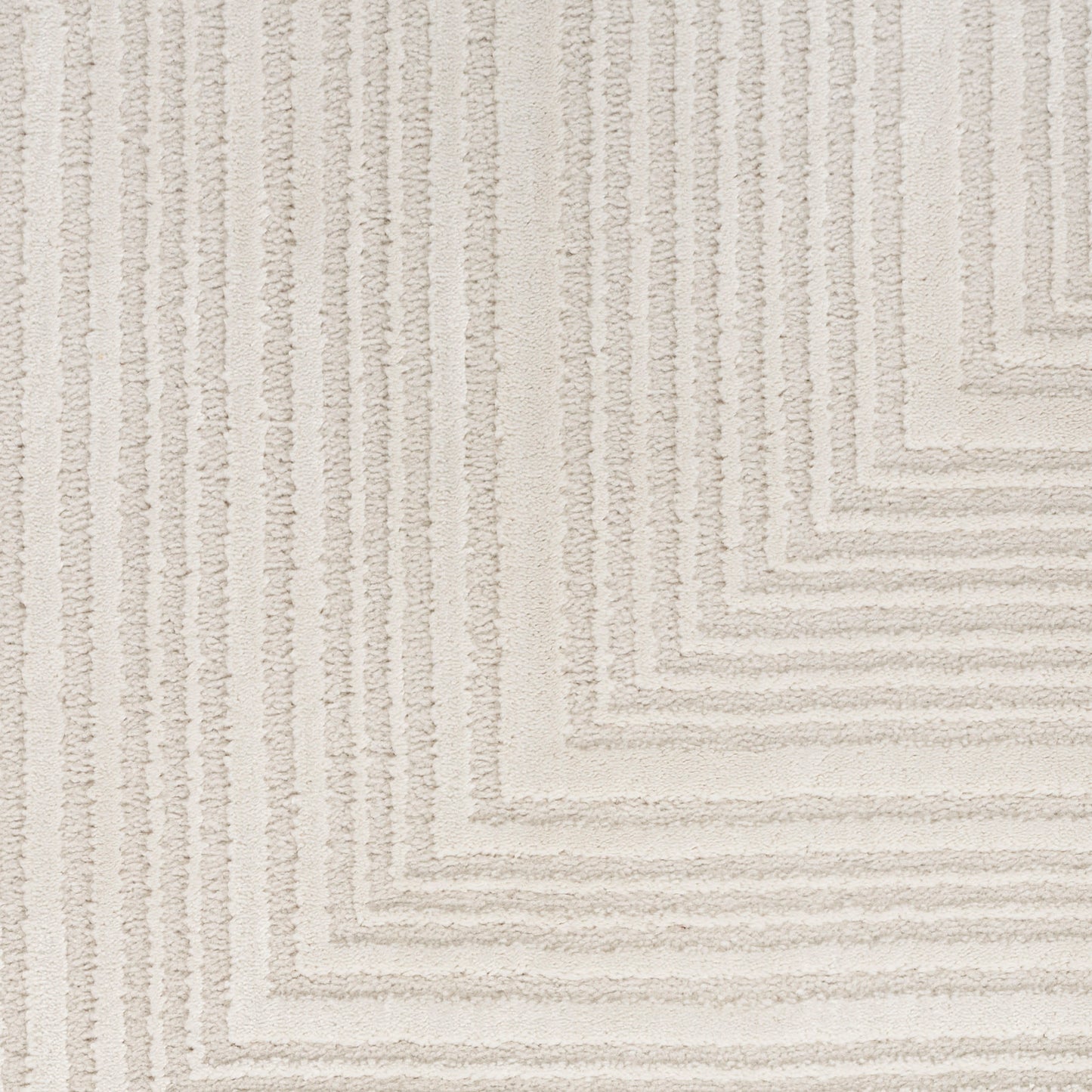 Cream tufted area rug with a stepped square border pattern; soft pile, modern, versatile for living rooms.