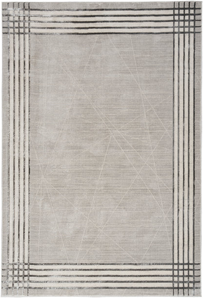 Beige rectangular rug with black linear border patterns and subtle texture, modern minimalist style.