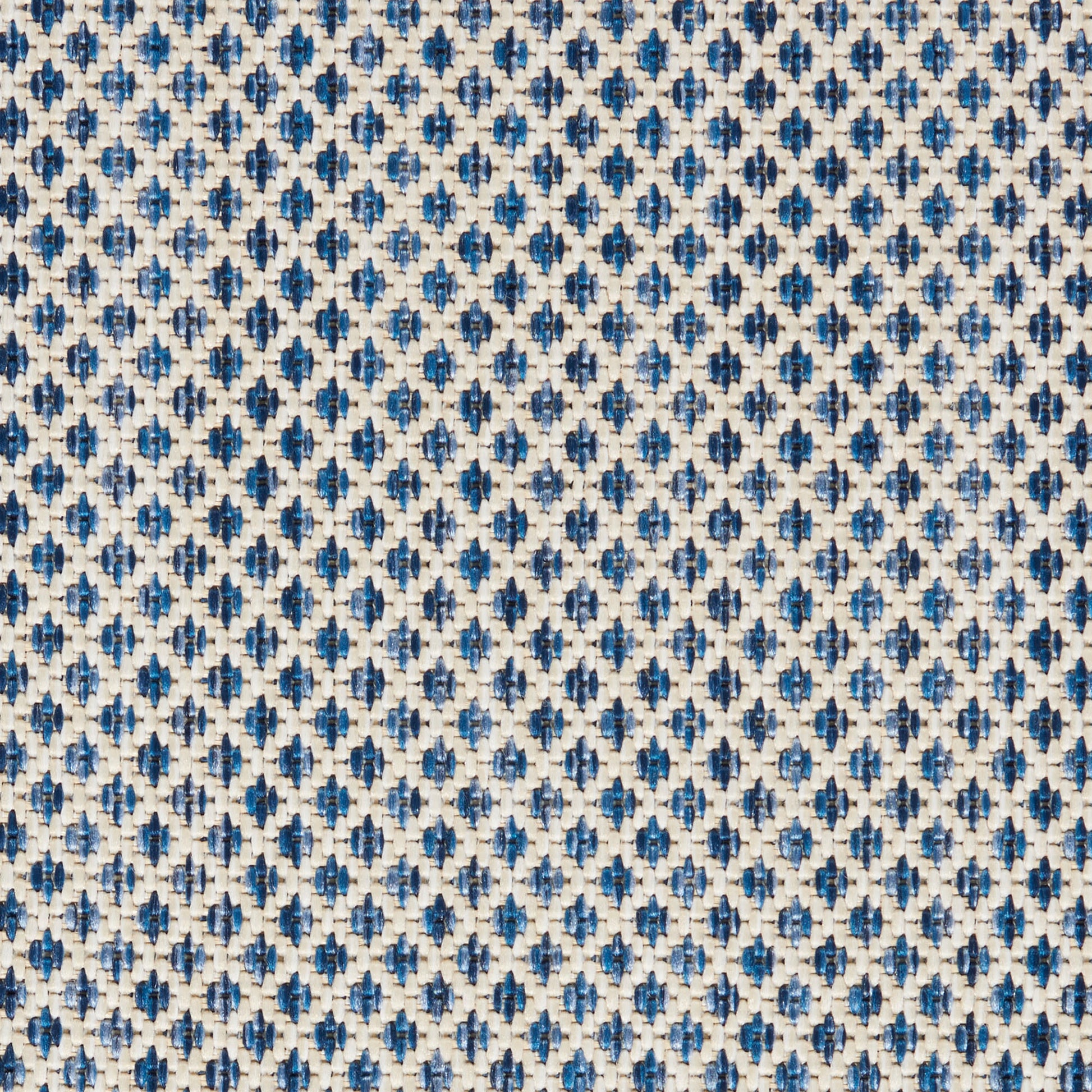 Woven fabric with tiny navy and sky-blue diamond motifs on ivory background; versatile upholstery textile use.