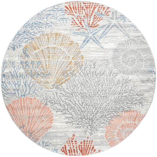Round coastal rug with coral and sea fan motifs in pastel blues, pinks, and yellows on a light gray background.
