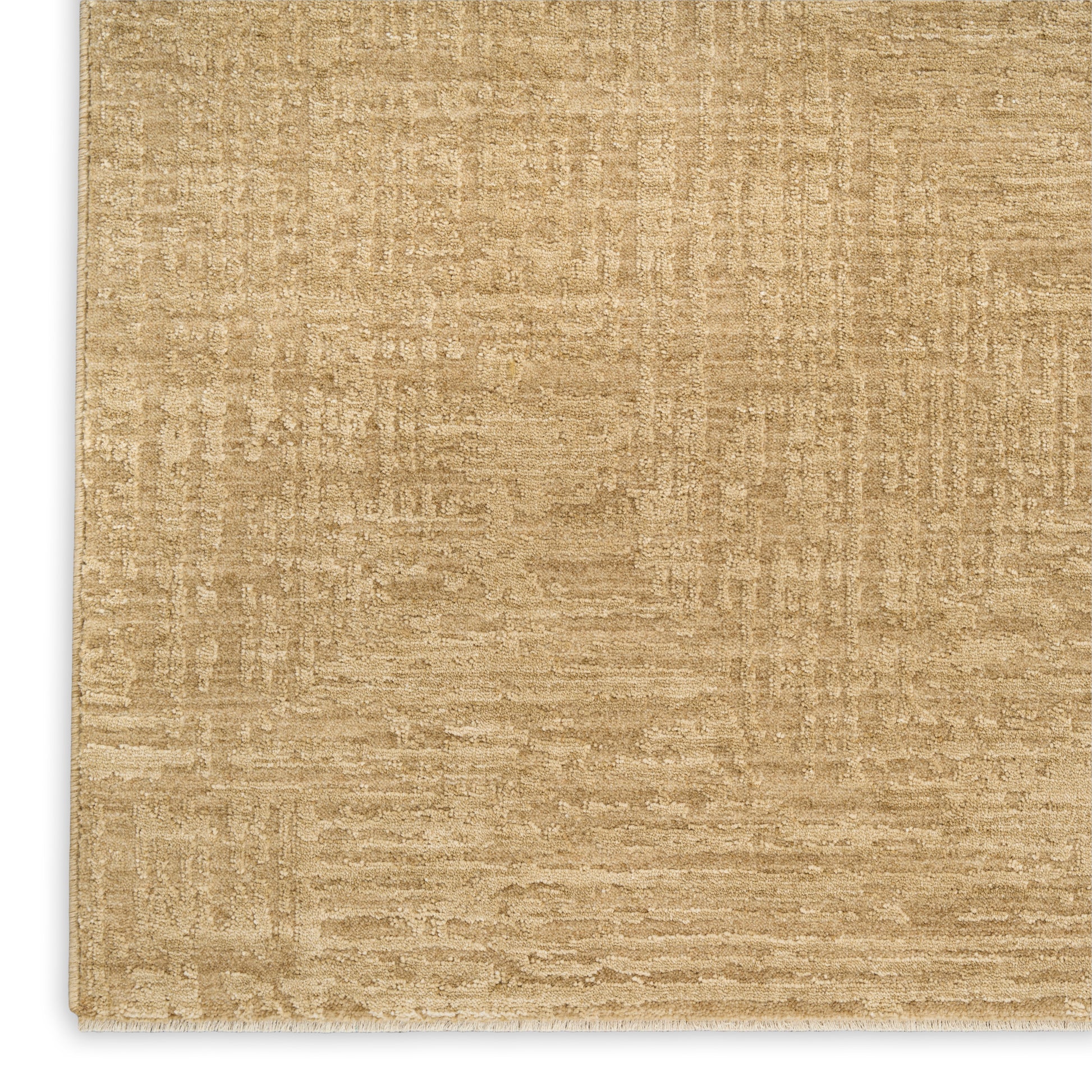 Beige textured rug close-up; flat-weave style in warm tan tones.