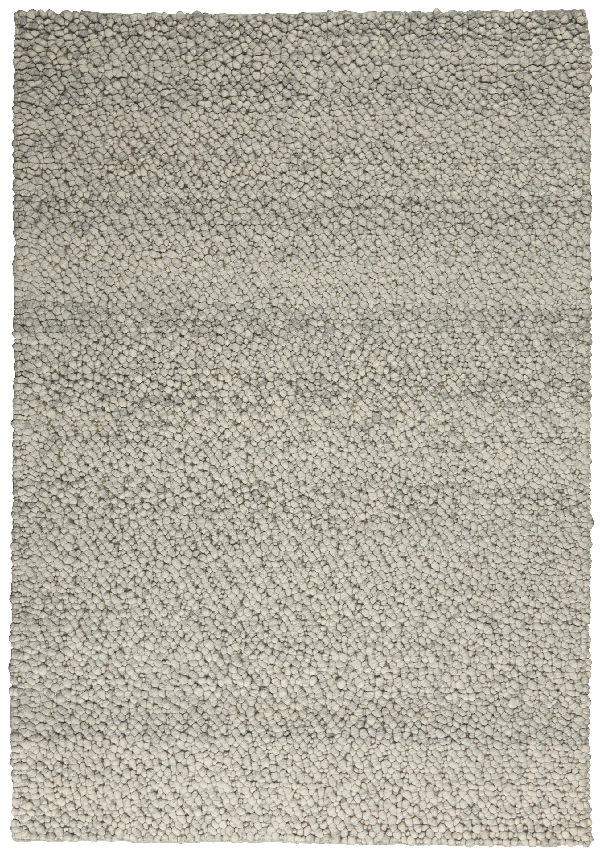 Rectangular light beige shag rug with dense, pebble-like tufted pile and gray undertones.
