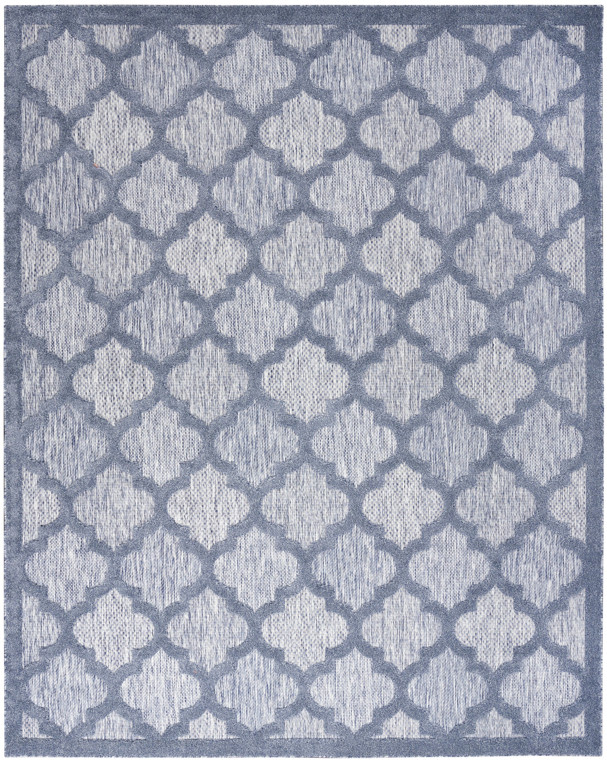 Blue-gray rug with repeating quatrefoil trellis pattern and textured weave, framed by a darker border.