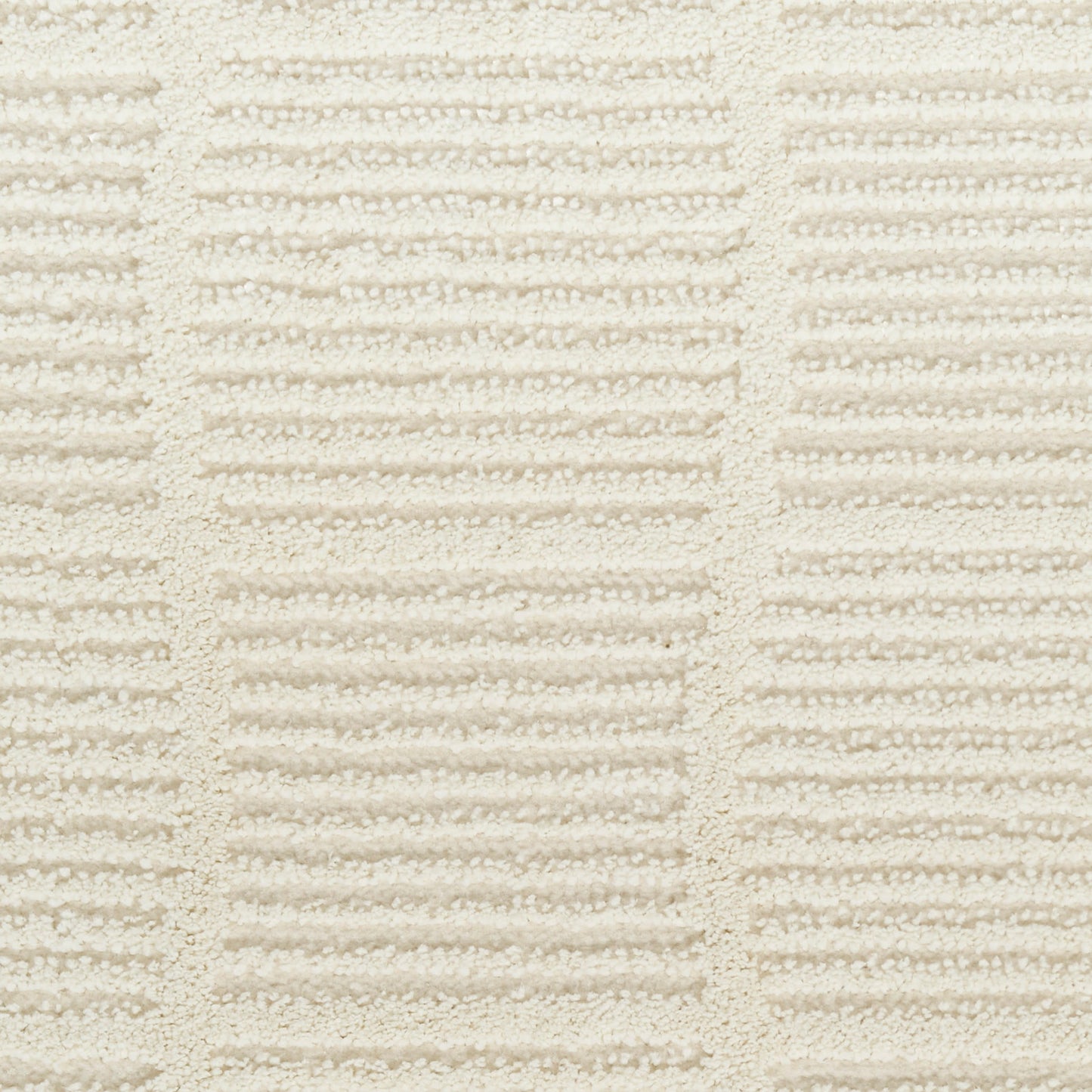 Cream terry towel fabric close-up with alternating raised ridges forming rectangular blocks
