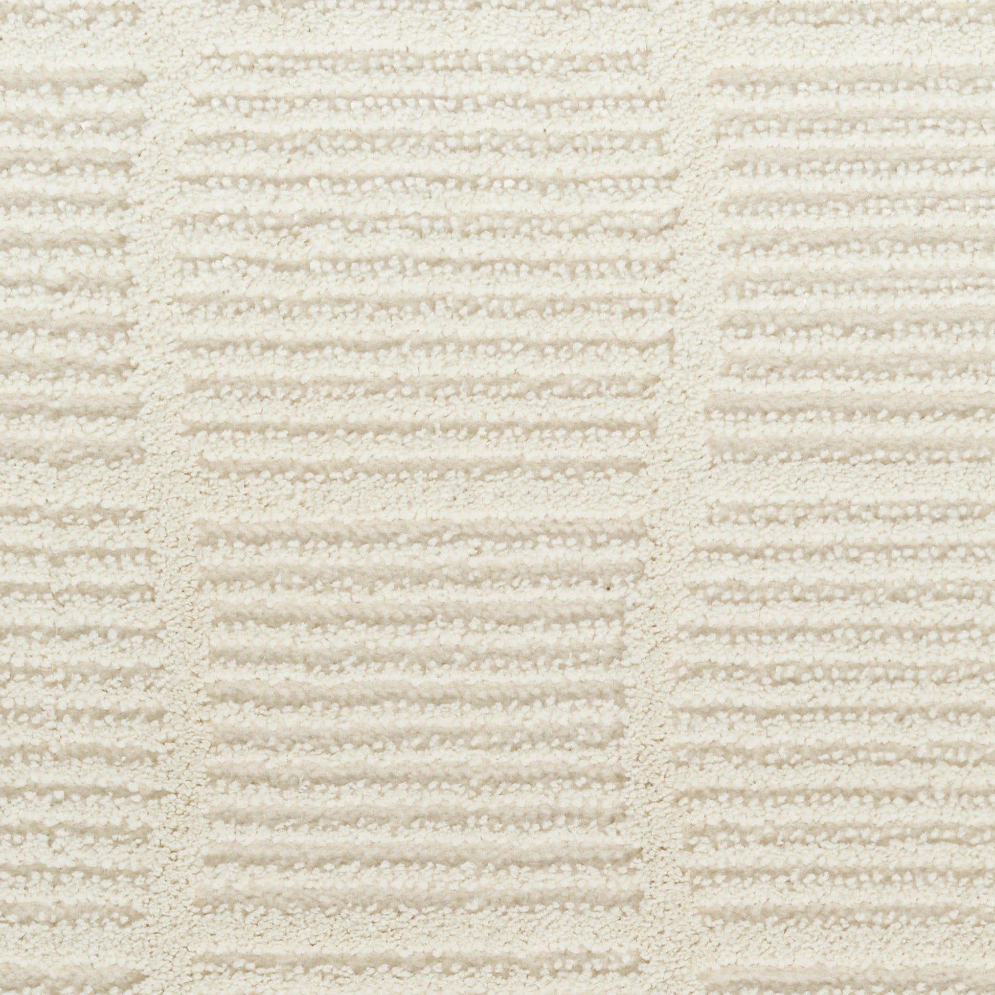 Cream terry towel fabric close-up with alternating raised ridges forming rectangular blocks