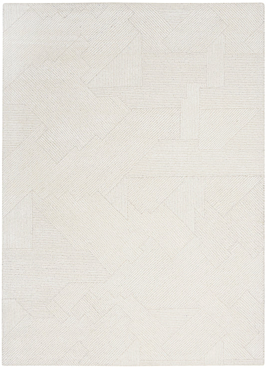 Cream-colored area rug with a geometric patchwork of striped rectangles and subtle texture.