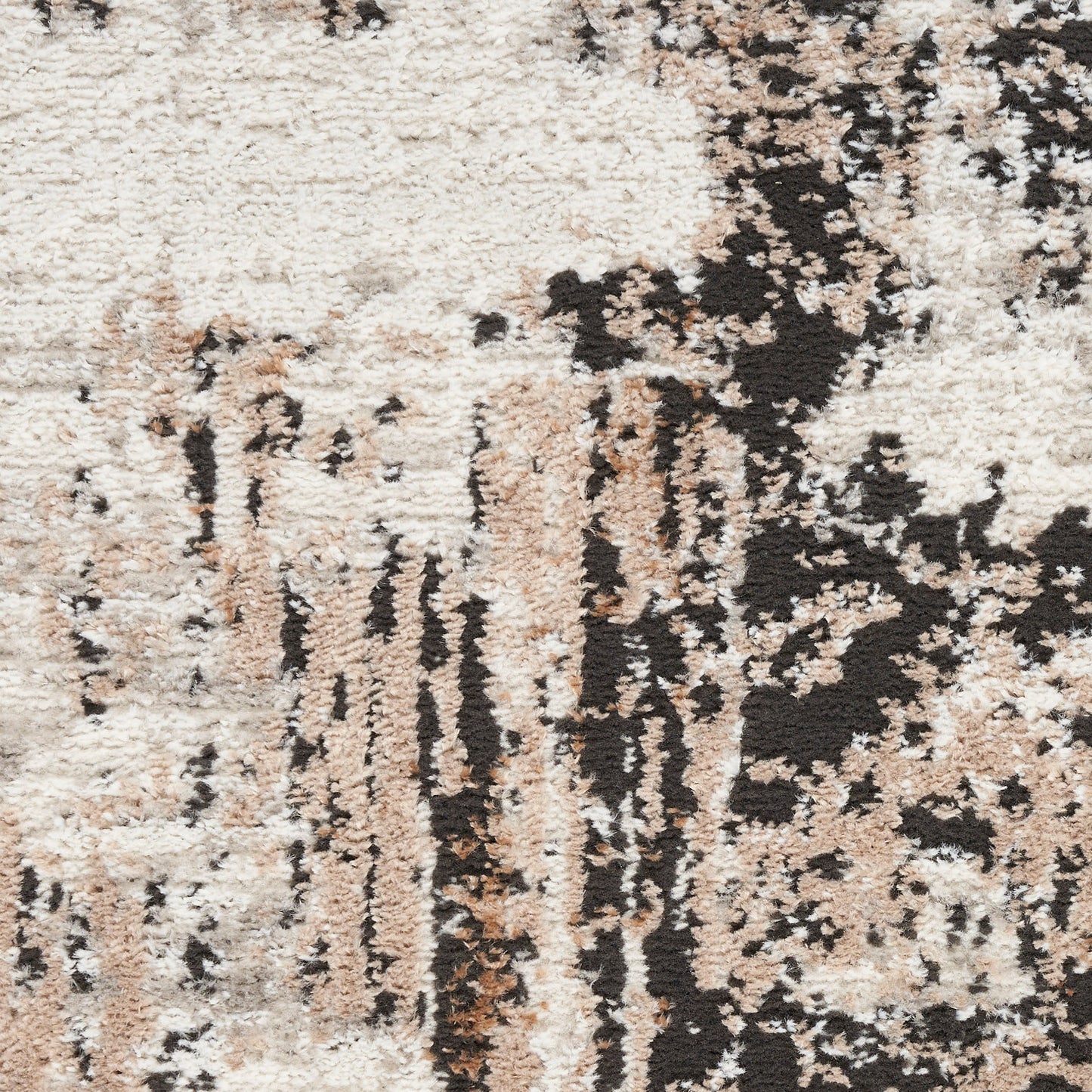 Neutral abstract shag rug in cream, beige, tan & black with irregular blotches and a plush high-pile texture.