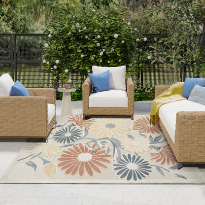 Outdoor floral-pattern rug, 8' x 11', placed in a garden setting.