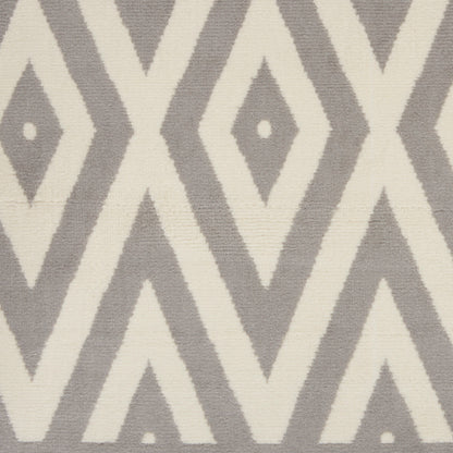 Grey and ivory geometric diamond chevron runner rug with woven texture.