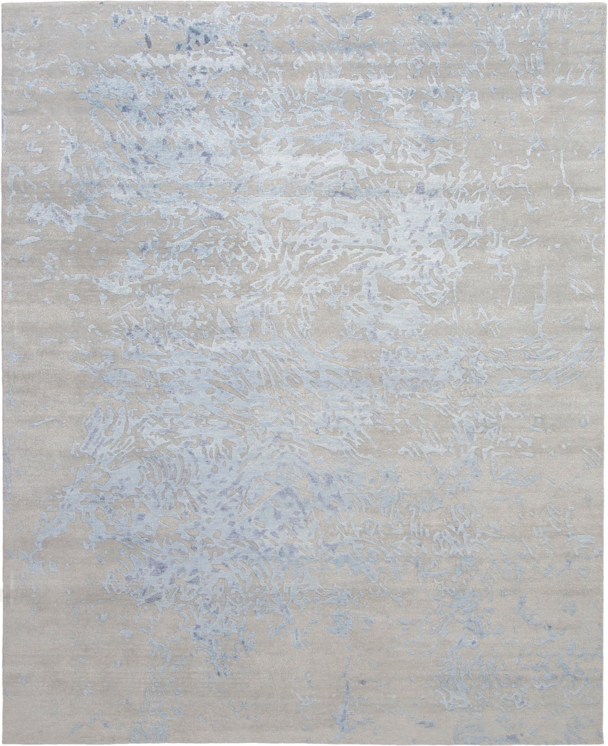 Beige abstract area rug with pale blue-gray marbled veining.