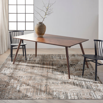 Mid-century wooden dining table with tapered legs, paired with black chairs, ceramic vase centerpiece on a textured beige rug.