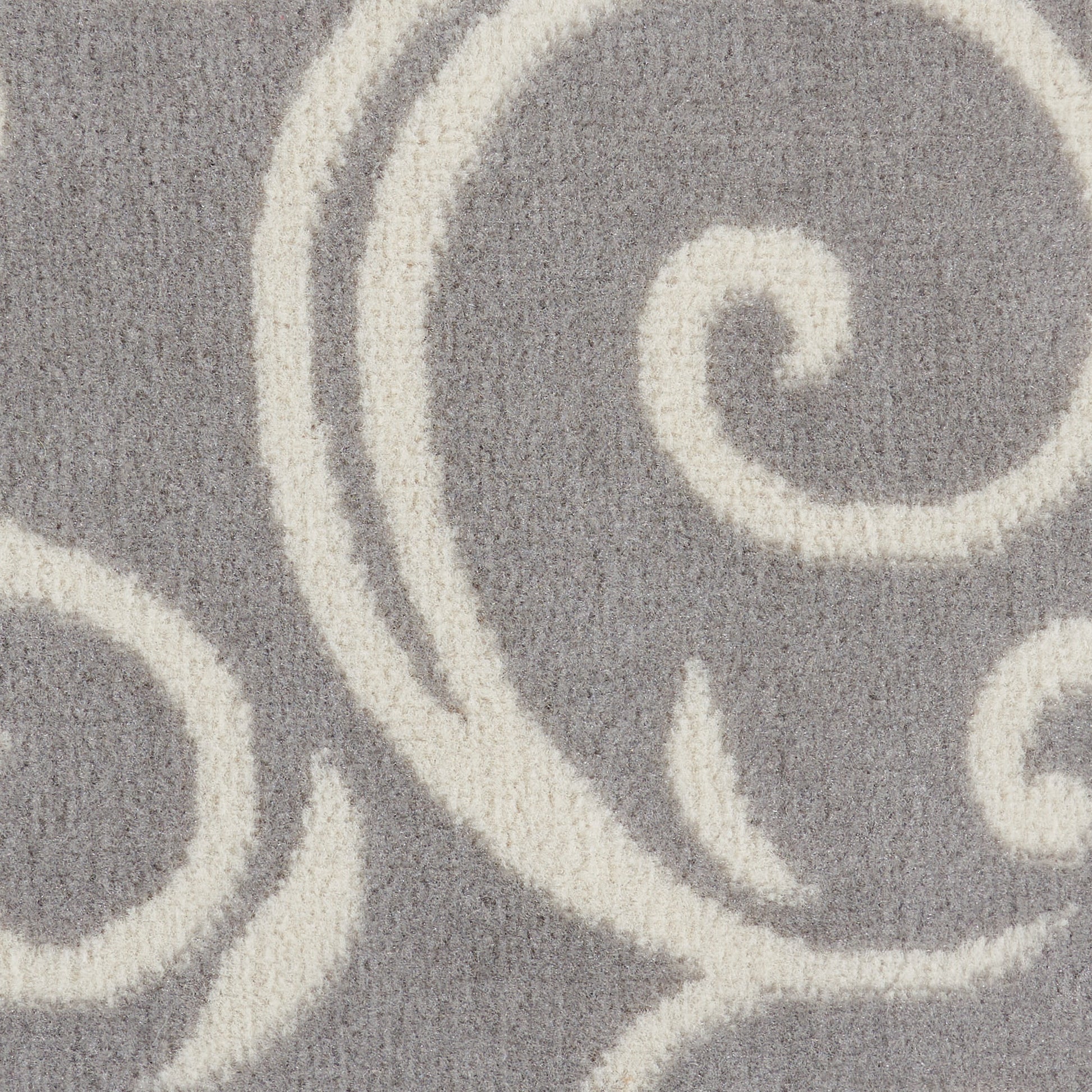 Grey rug with cream swirling scroll pattern, plush textured pile, modern decorative accent for living rooms.