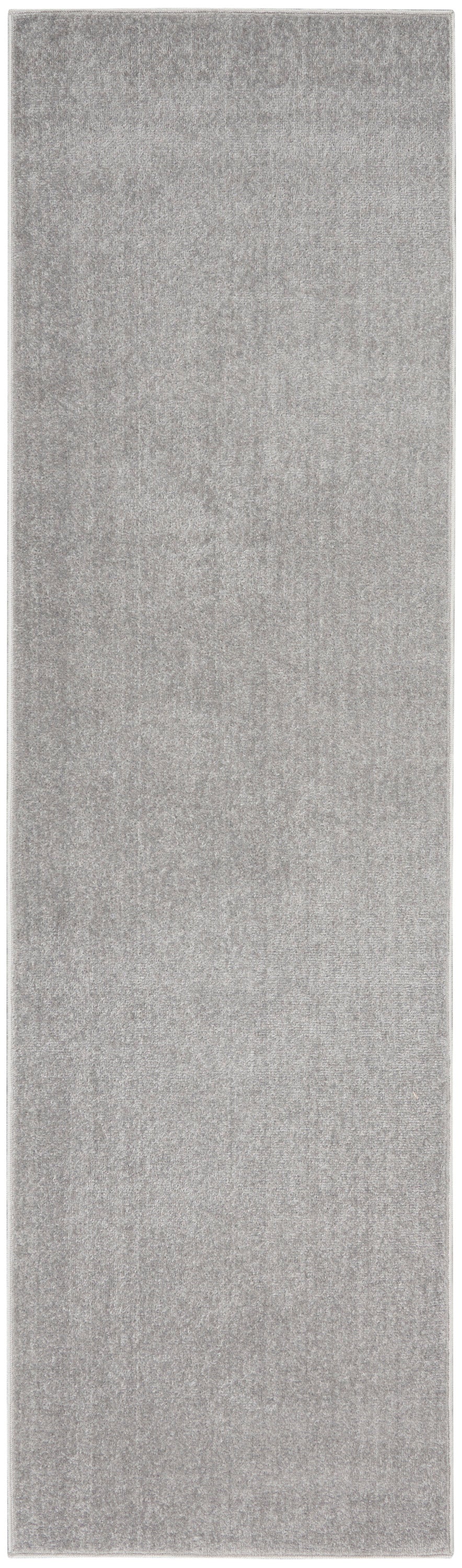 Grey textured outdoor rug runner; long rectangular mat.