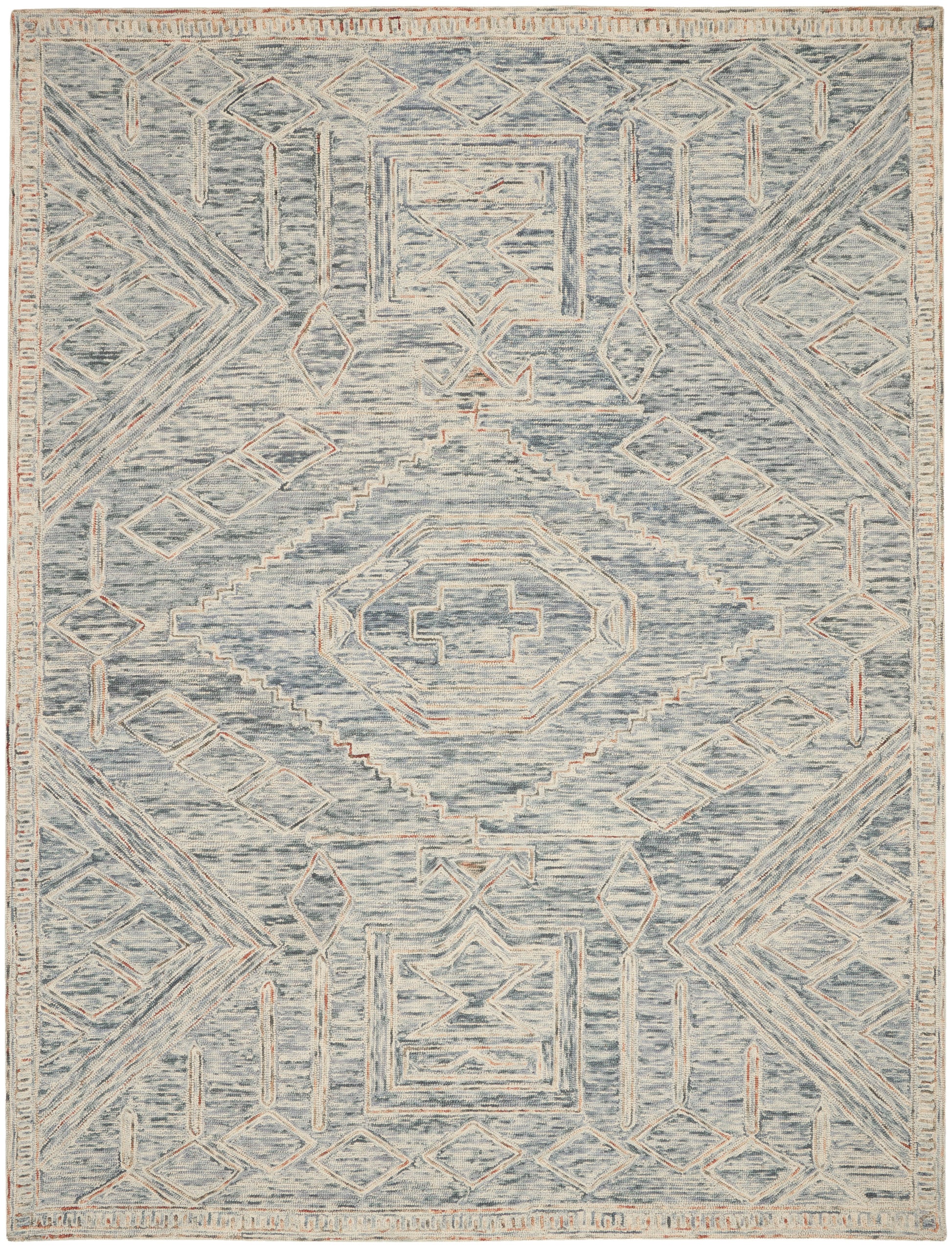 Blue-gray area rug with cream geometric medallions and peach accents in a distressed, vintage-inspired tribal pattern.