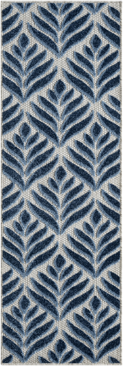 Blue botanical-pattern rug runner with navy leaf motifs on a light beige ground; plush textured pile.