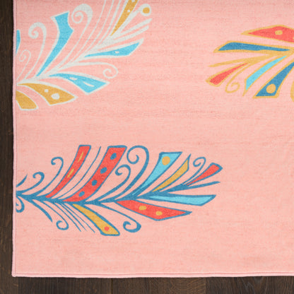 Pink rug with swirling feather-like motifs in blue, yellow, orange and red; boho decorative textile.