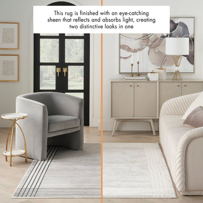 Two-tone area rug with dark gray left half and pale beige right half, in a modern living room.