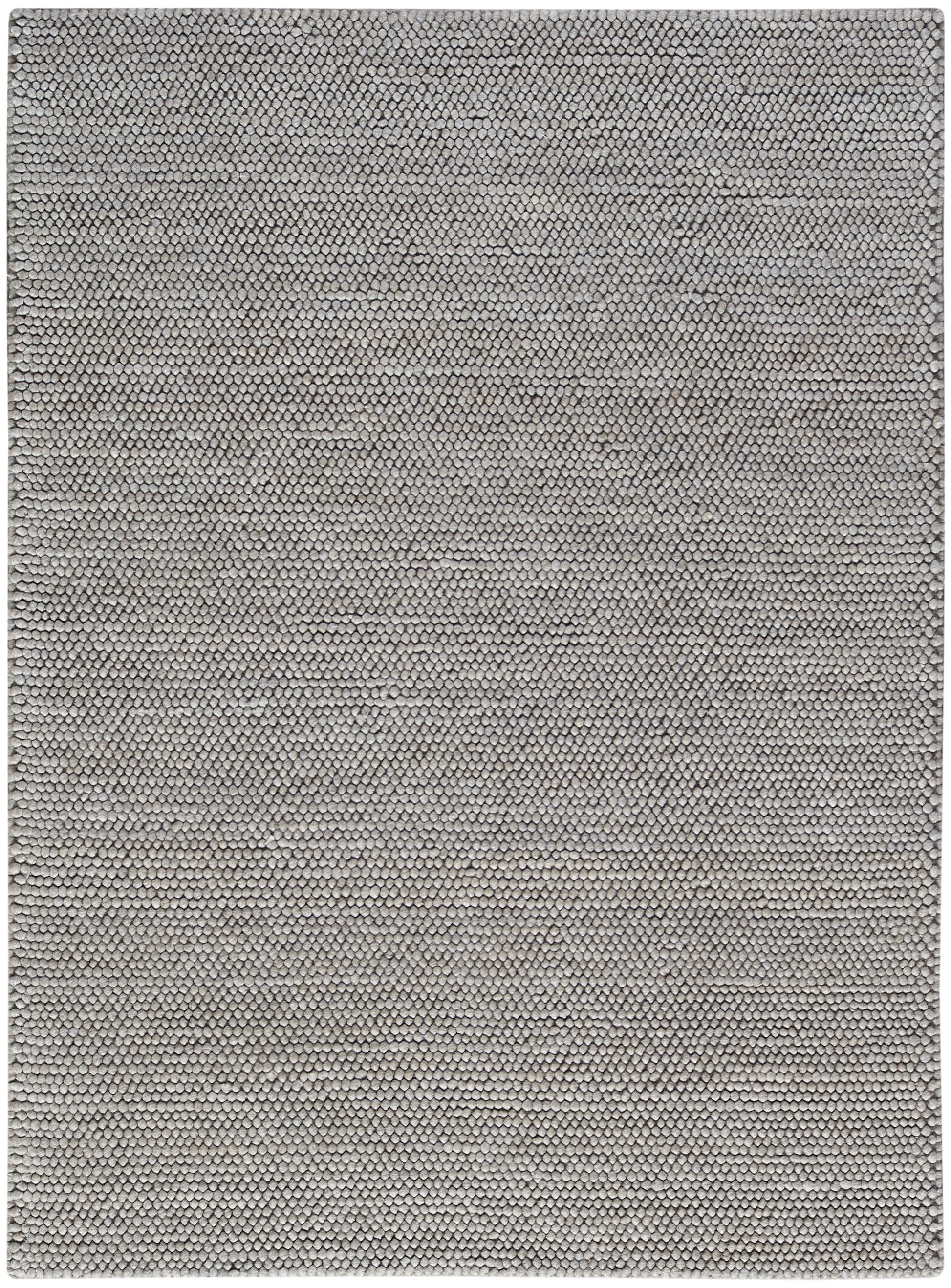 Beige-gray snakeskin texture rug with tiny overlapping scales and soft, neutral tones.